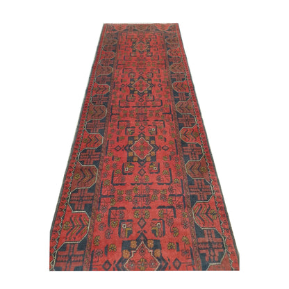 Length view of Afghan Khal Mohammadi hand-knotted wool runner rug showing repeating medallions and dark geometric border, 287 x 84 cm