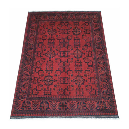 Angled view of Afghan Khal Mohammadi wool rug with red field and dark patterned borders, 196 x 150 cm