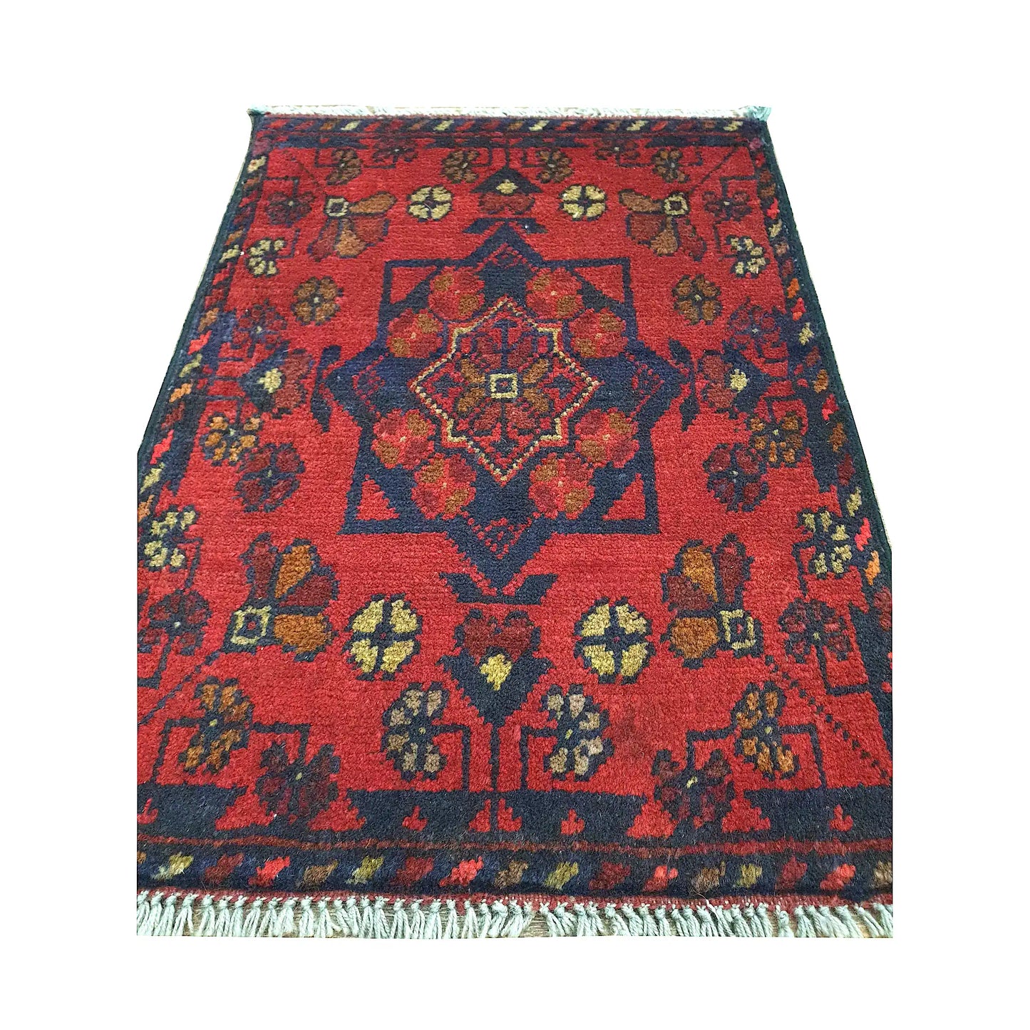 Afghan Khal Mohammadi wool rug detail showing red field, central medallion and traditional floral geometric pattern