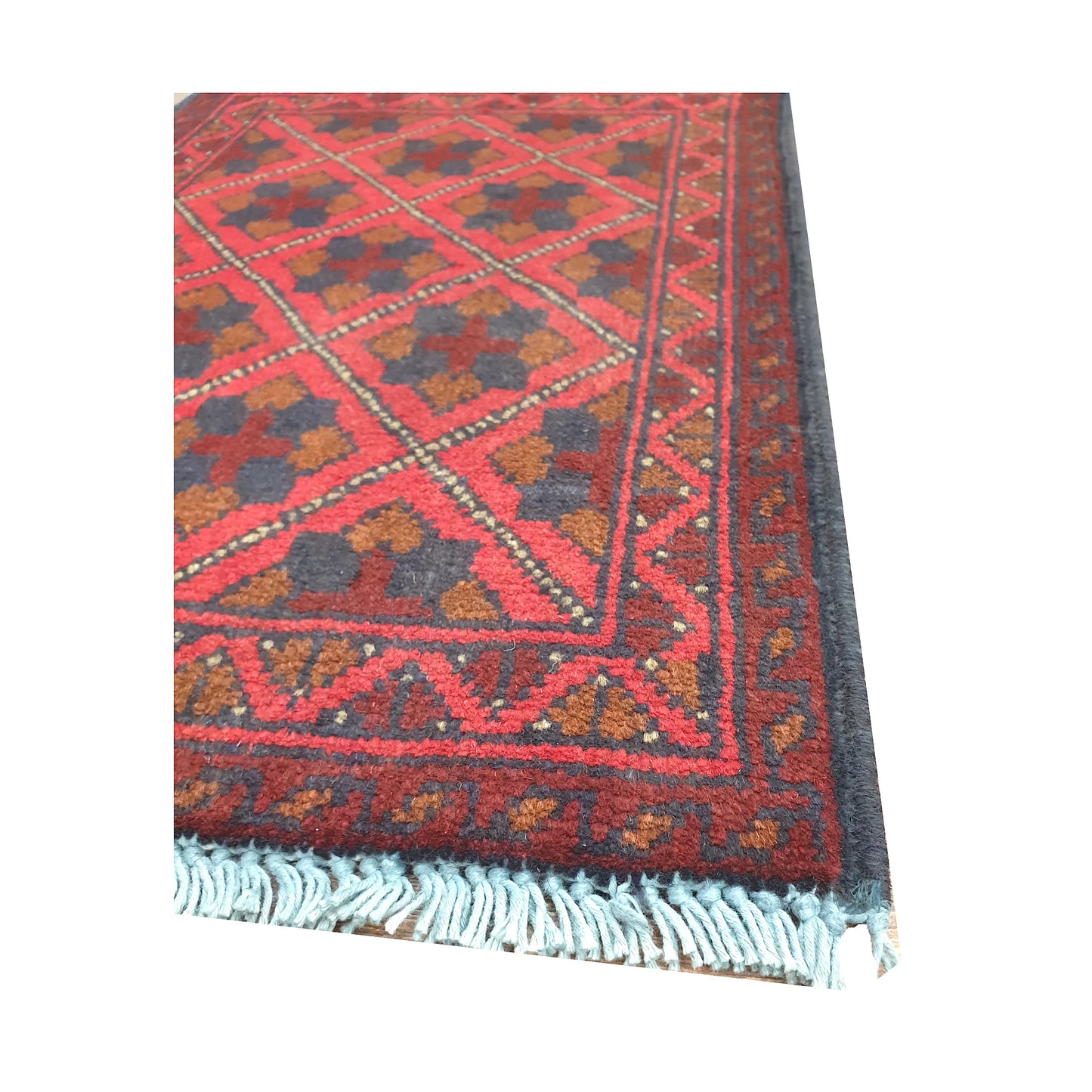 Fringe and border detail of Afghan Khal Mohammadi wool rug showing red field and dark geometric edging