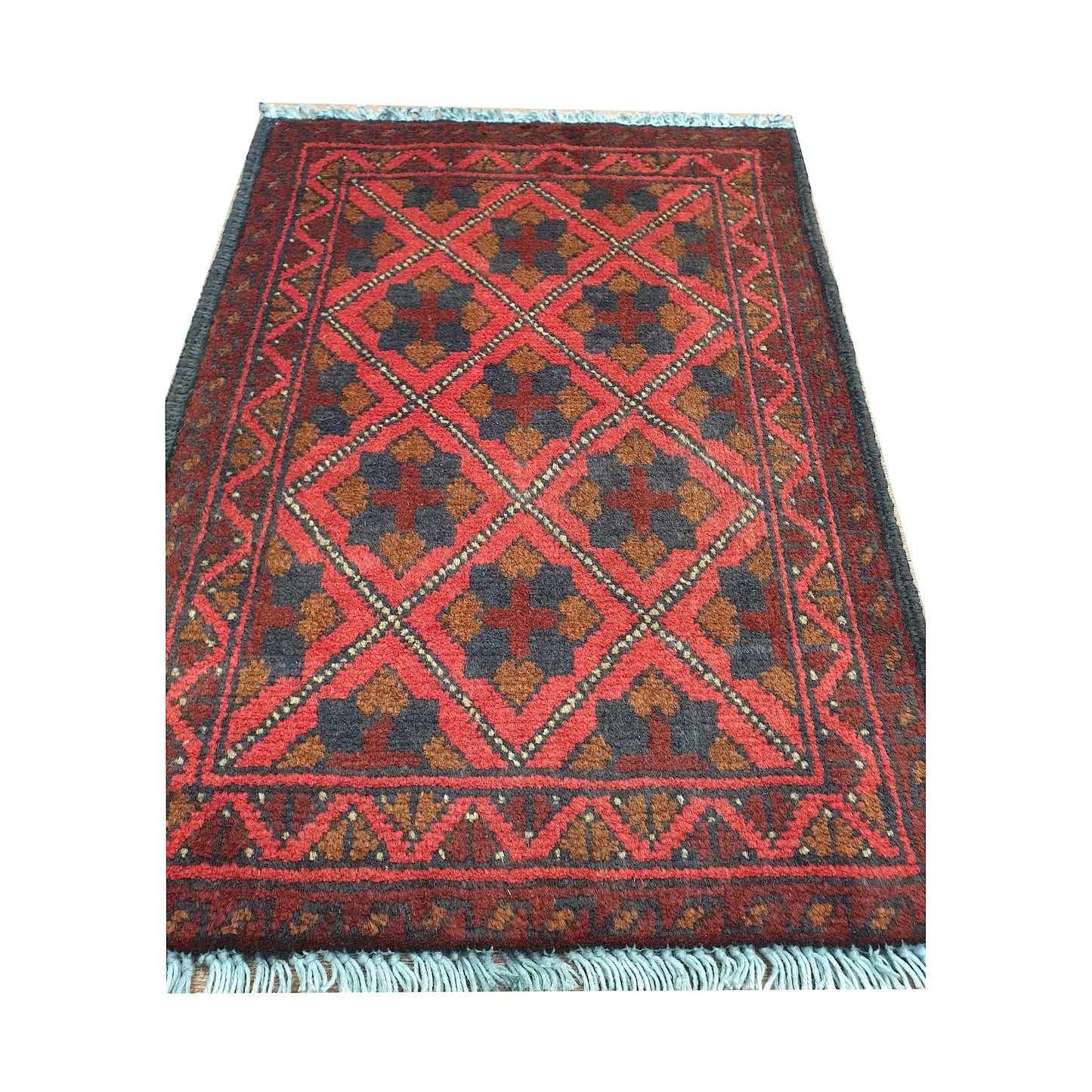 Afghan Khal Mohammadi wool rug detail showing red diamond lattice field with floral tribal motifs
