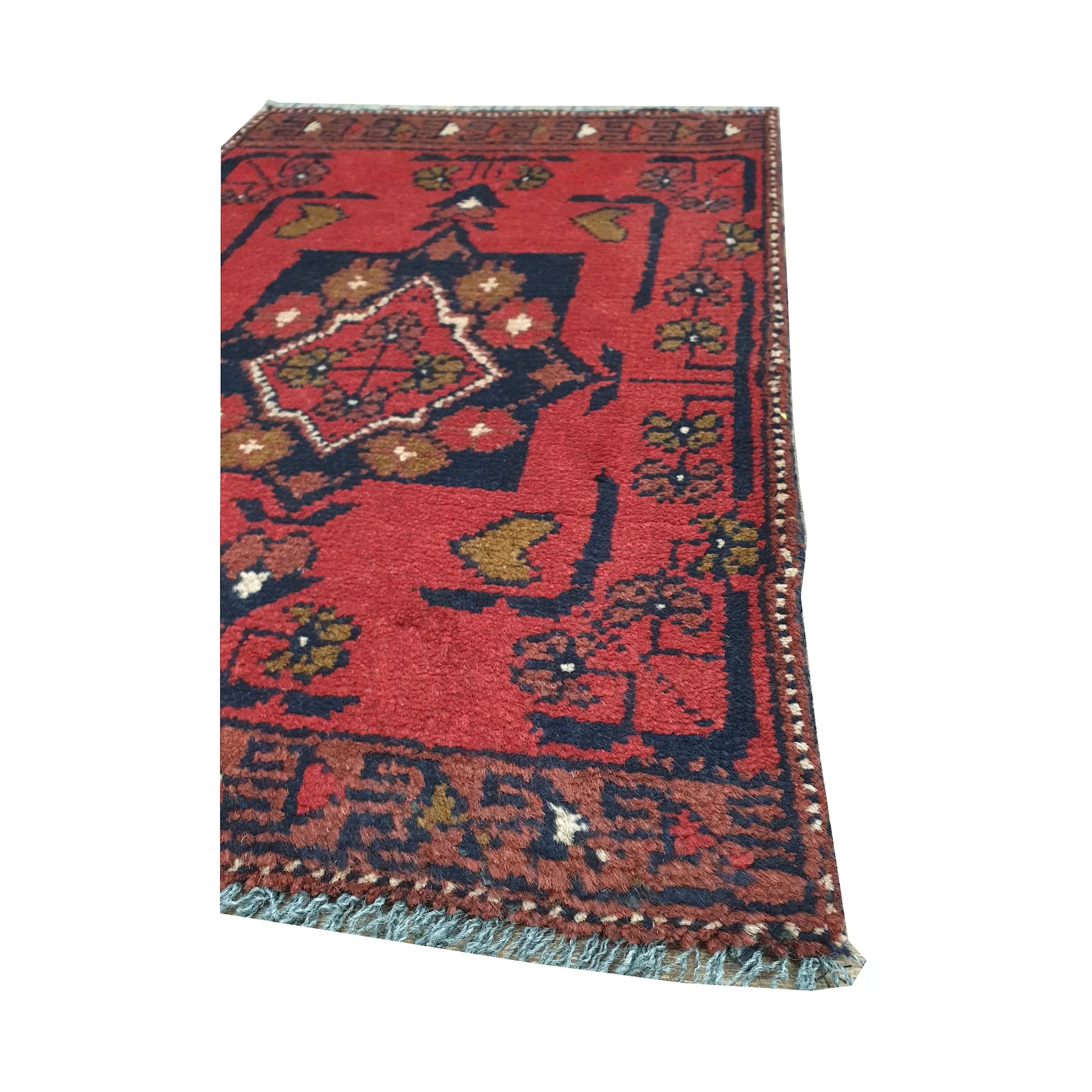Fringe and border detail of Afghan Khal Mohammadi wool rug showing red field, dark edging and tribal motifs