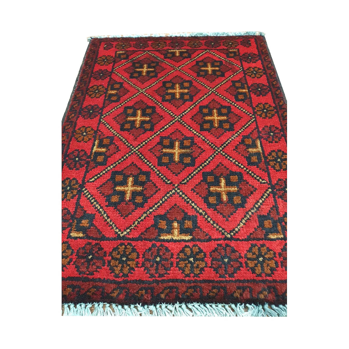Afghan Khal Mohammadi wool rug detail showing red diamond lattice with ochre cross motifs and dark outlines