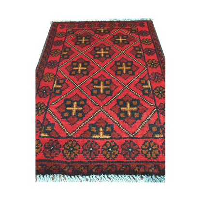 Afghan Khal Mohammadi wool rug detail showing red diamond lattice with ochre cross motifs and dark outlines