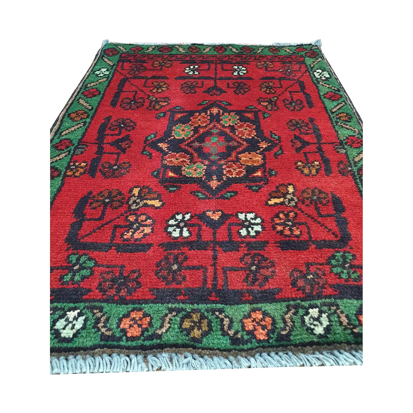 Afghan Khal Mohammadi wool rug detail showing red field, central floral medallion and scattered tribal motifs