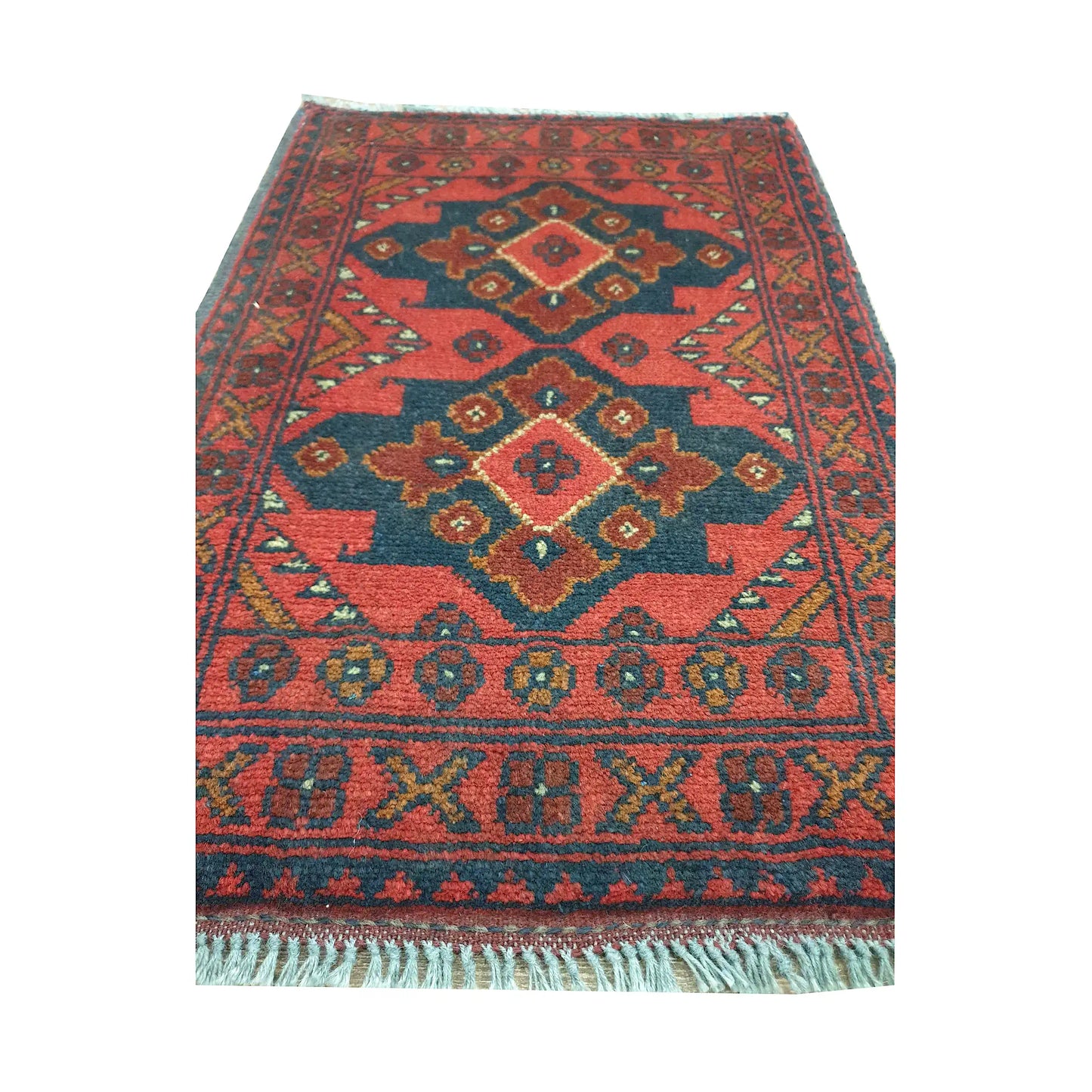 Afghan Khal Mohammadi wool rug detail showing three stepped diamond medallions with dark blue, ochre and ivory geometry