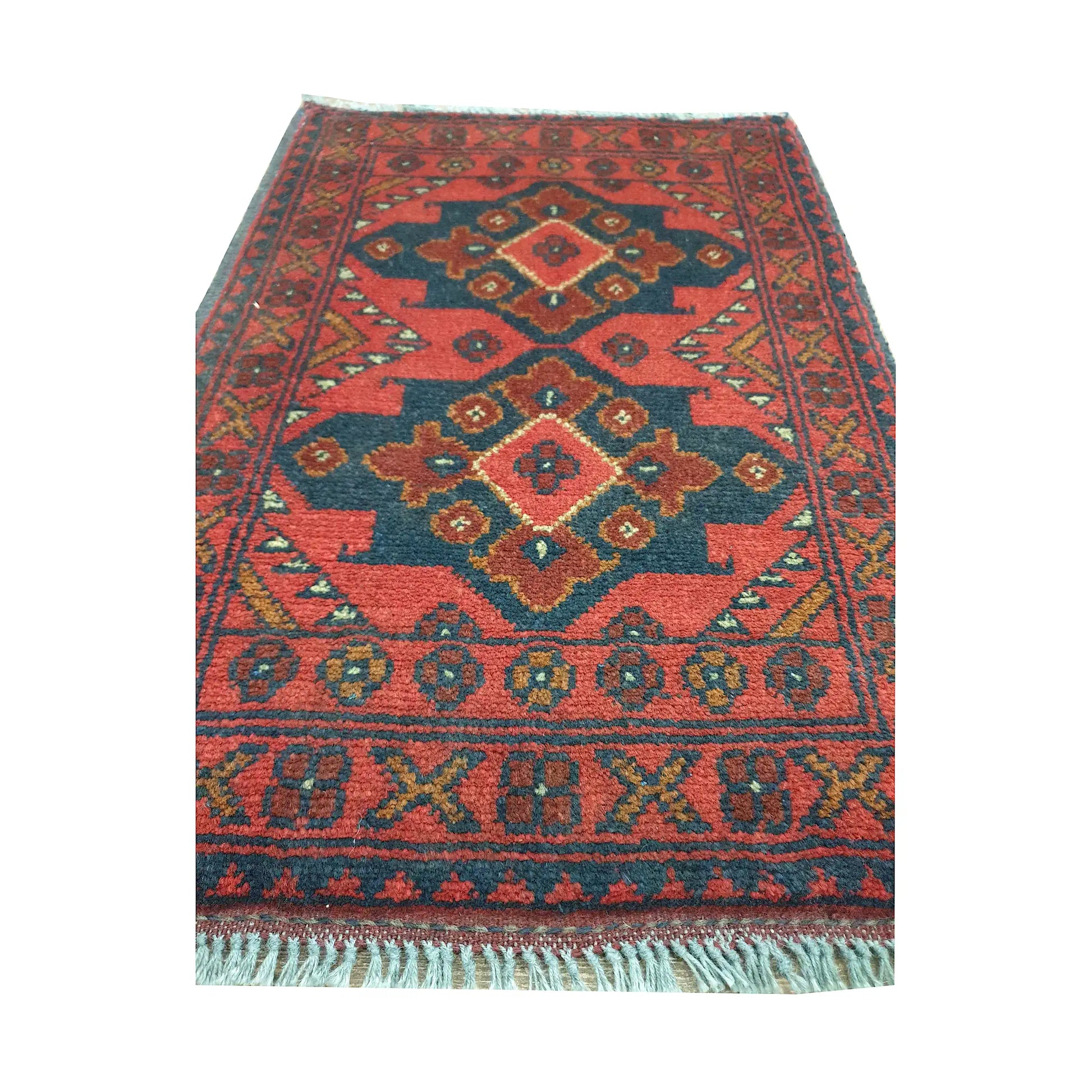 Afghan Khal Mohammadi wool rug detail showing three stepped diamond medallions with dark blue, ochre and ivory geometry