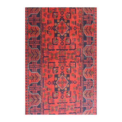 Field detail of Afghan Khal Mohammadi runner showing repeating red and navy medallions with small angular motifs