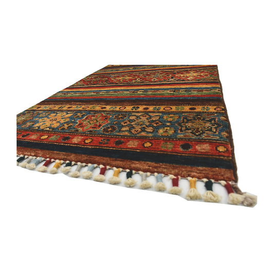Angled fringe edge detail of Afghan Khurjeen wool rug showing rust, blue, golden beige and dark patterned bands