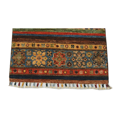 End border and fringe detail of Afghan Khurjeen hand-knotted rug showing striped field, geometric motifs and tassel fringe