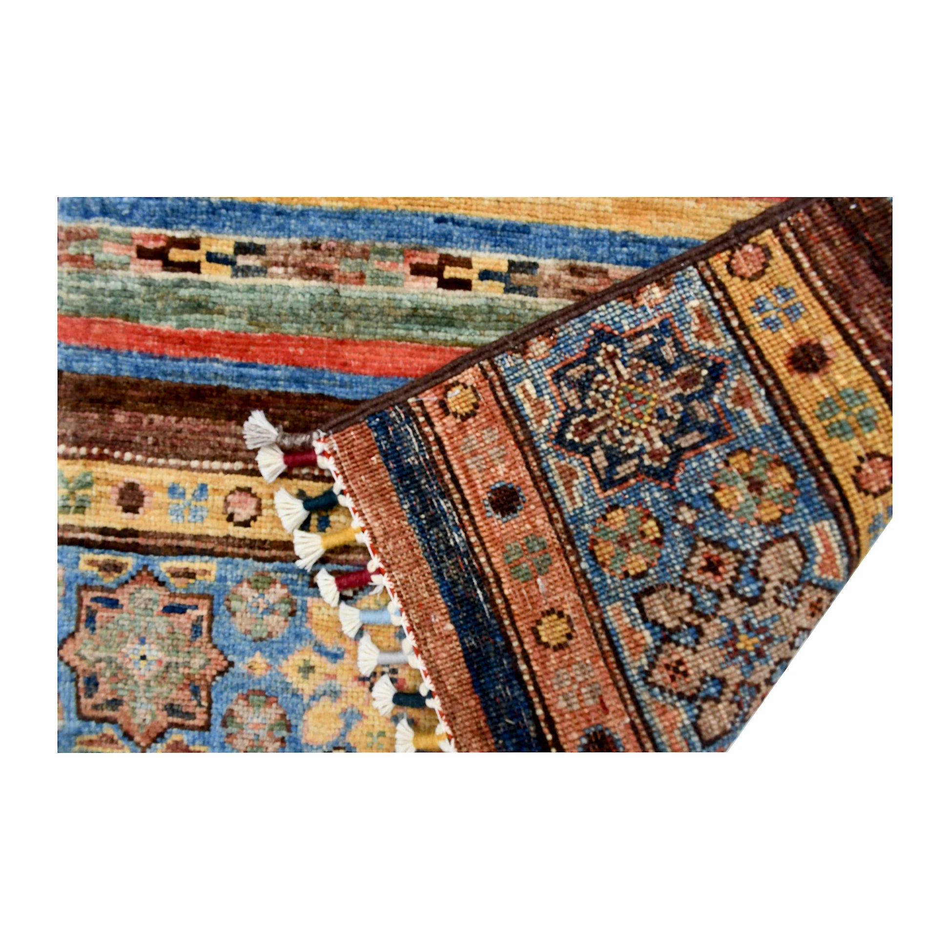 Folded corner and fringe detail of Afghan Khurjeen hand-knotted wool rug showing patterned bands, tassels and woven surface detail