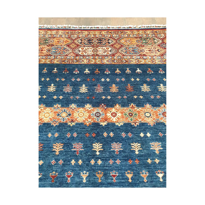 Blue field motif detail of Afghan Khurjeen wool rug with botanical tribal design