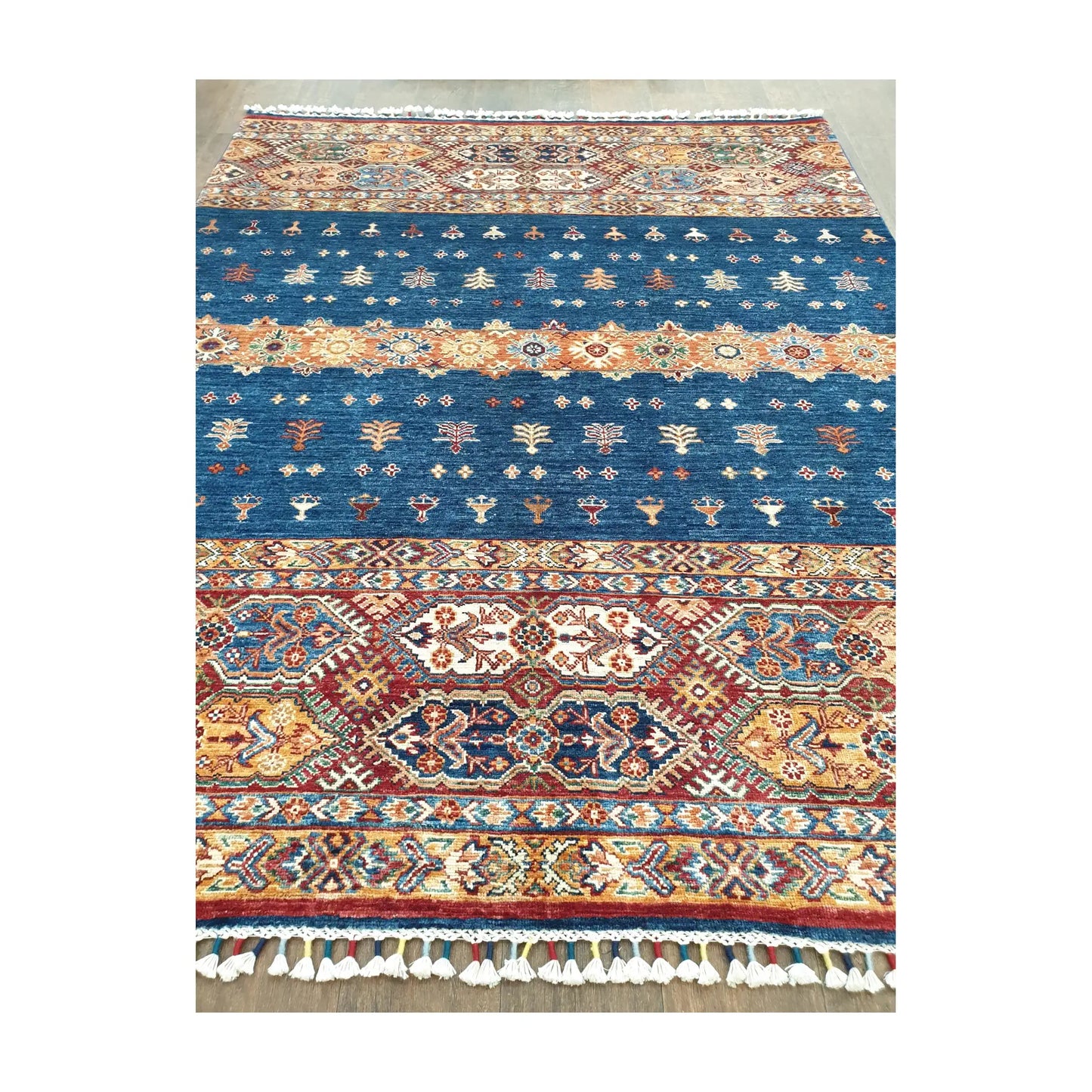 Field and border detail of Afghan Khurjeen hand-knotted rug with patterned bands