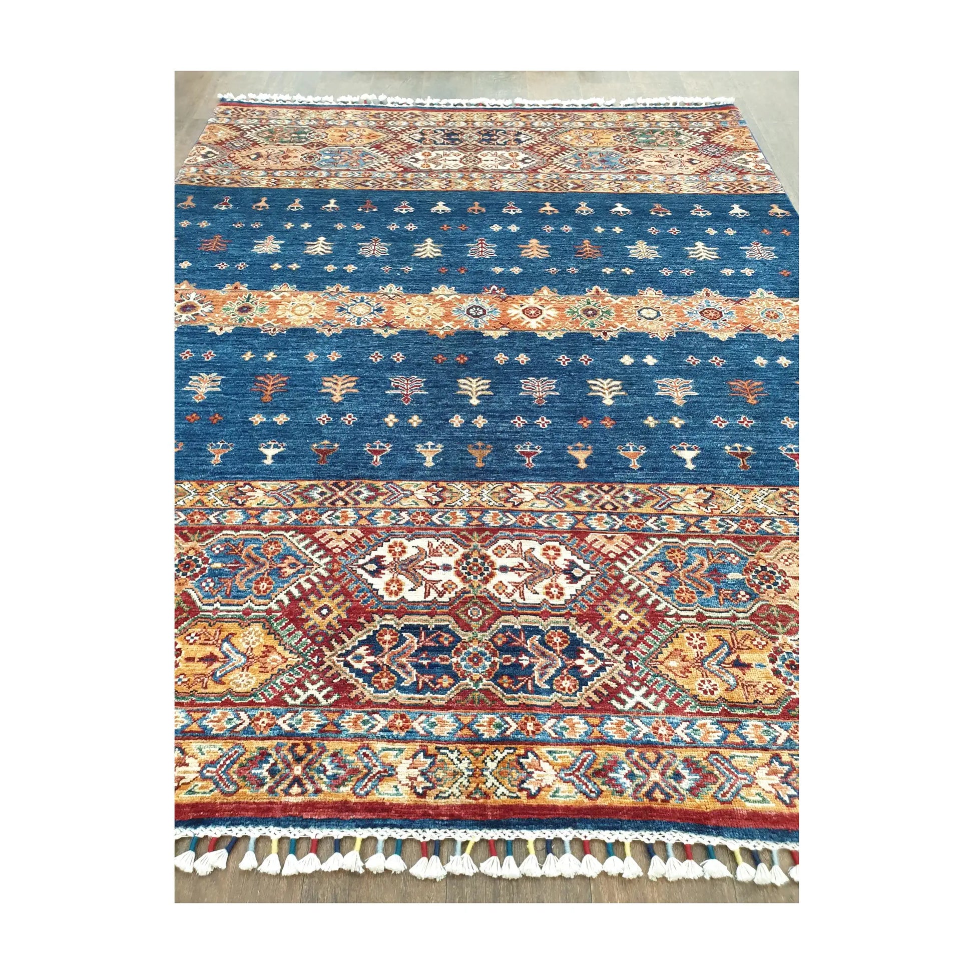 Field and border detail of Afghan Khurjeen hand-knotted rug with patterned bands