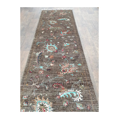 Angled full view of Afghan Khurjeen runner rug showing long field and colourful motifs