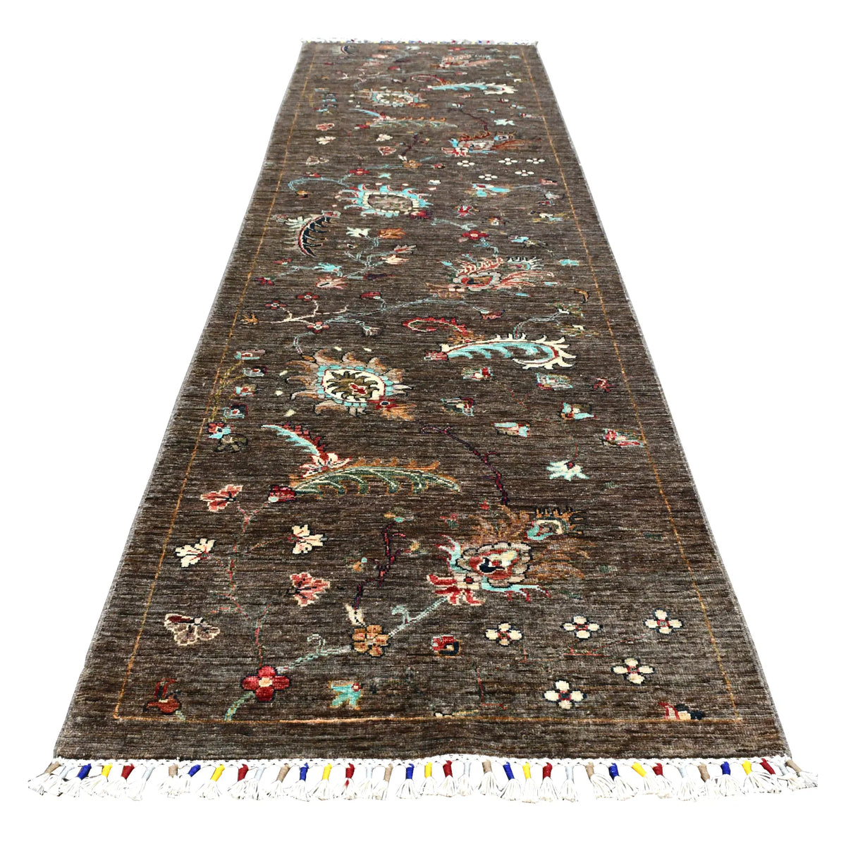 Full view of Afghan Khurjeen hand-knotted wool runner with colourful botanical motifs on a deep brown field, 299 x 80 cm