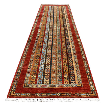 Full view of Afghan Khurjeen hand-knotted wool runner with narrow geometric bands framed in rust red, 305 x 90 cm