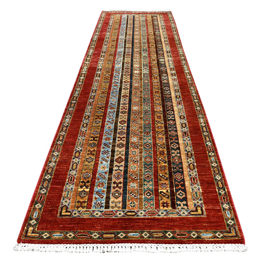 Full view of Afghan Khurjeen hand-knotted wool runner with narrow geometric bands framed in rust red, 305 x 90 cm