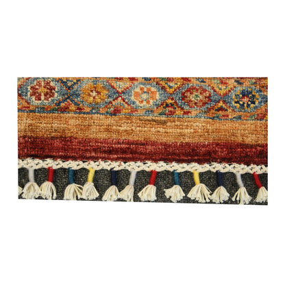 Close-up of Afghan Khurjeen rug showing the patterned end border and visible tassel fringe