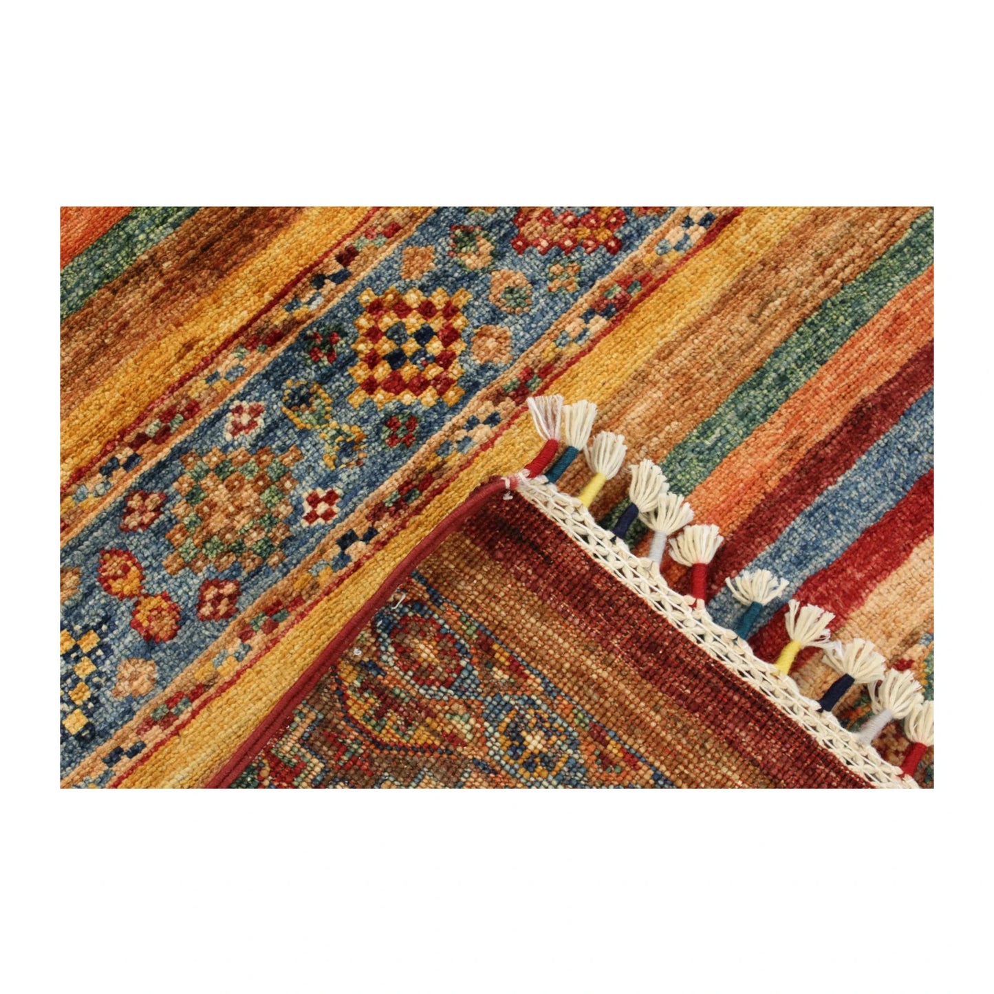 Folded-corner detail of Afghan Khurjeen rug showing the striped field, blue geometric band and tassel fringe