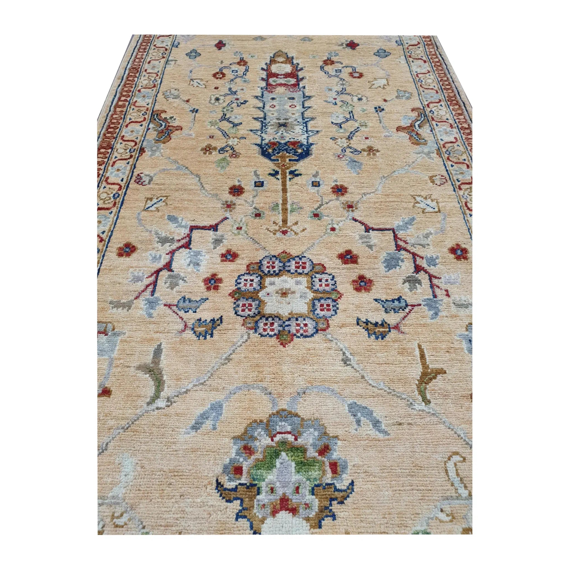 Close-up of Afghan Khurjeen wool runner rug showing the central floral medallion and surrounding vine motifs