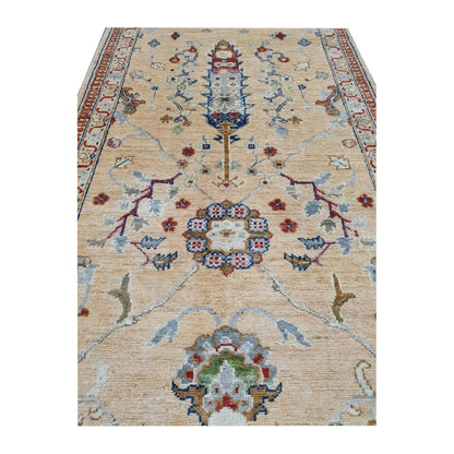 Close-up of Afghan Khurjeen wool runner rug showing the central floral medallion and surrounding vine motifs