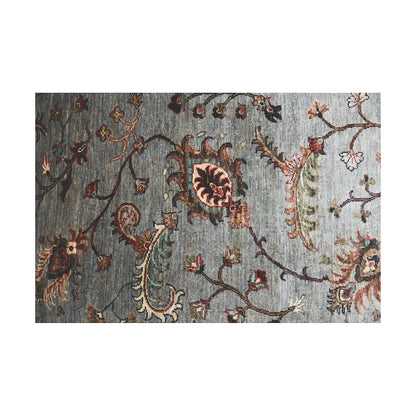 Close-up of Afghan Khurjeen runner rug with floral vine motifs, grey wool pile and muted multicolour accents