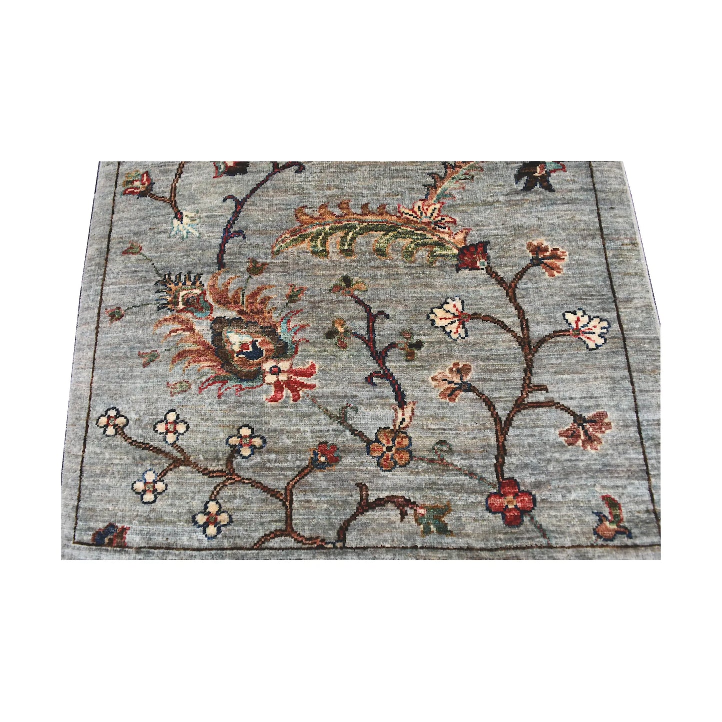 Field detail of Afghan Khurjeen runner rug with grey ground, branching floral vines and muted rust accents