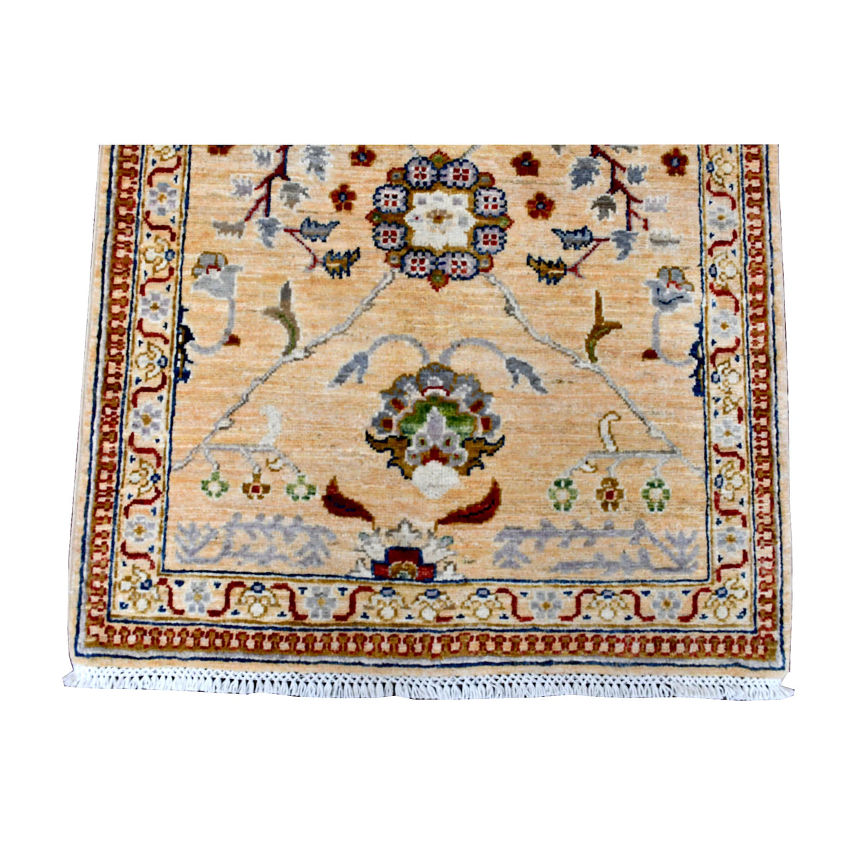 Fringe-end detail of Afghan Khurjeen runner showing a floral medallion, narrow multicoloured borders and white fringe
