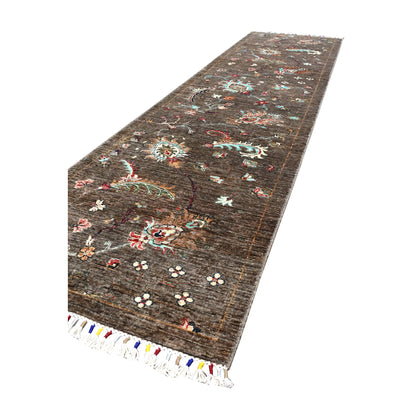 Angled full view of Afghan Khurjeen wool runner showing its elongated open-field composition