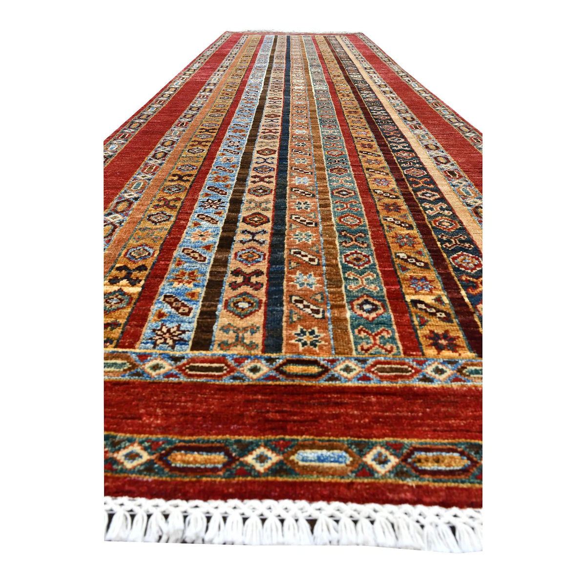 Angled end of Afghan Khurjeen runner showing multicoloured patterned bands within the rust-red frame