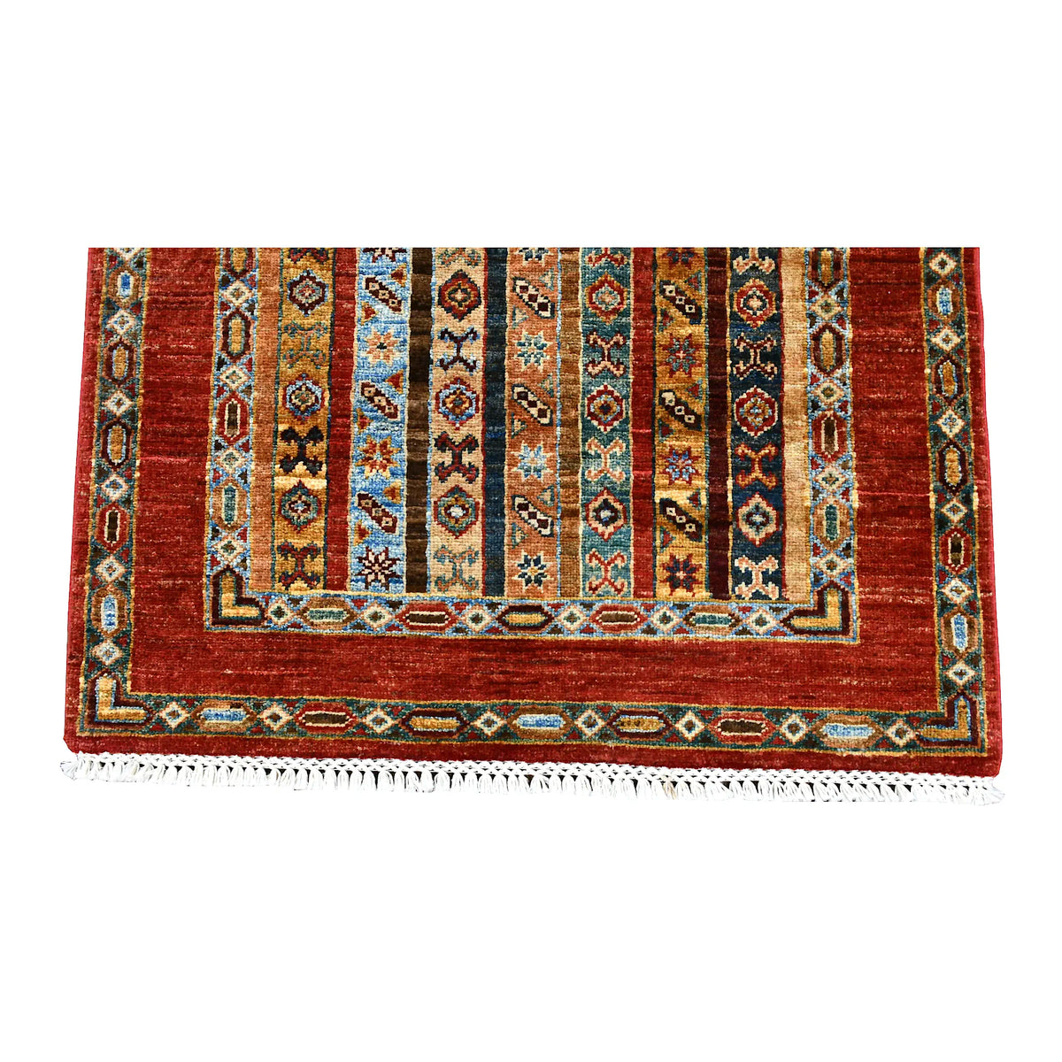 Overhead end section of Afghan Khurjeen runner showing geometric stripes, layered borders and fringe