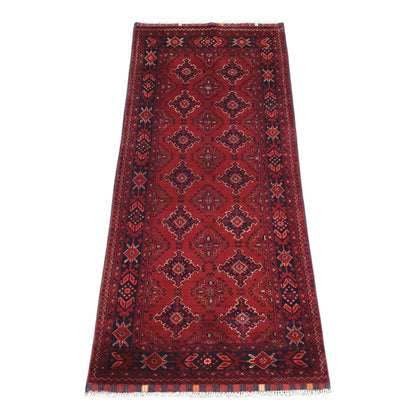 Afghan Kunduz hand-knotted wool runner rug 202 x 92 cm full view with red field and dark geometric diamond motifs
