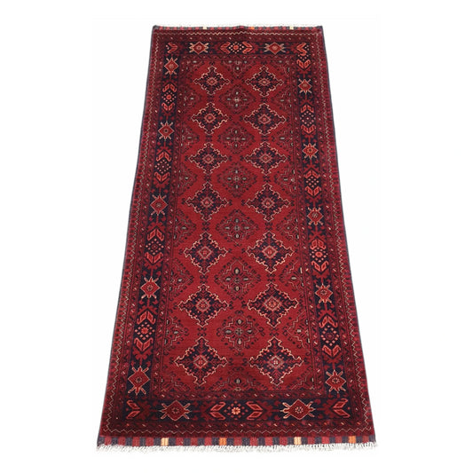 Afghan Kunduz hand-knotted wool runner rug 202 x 92 cm full view with red field and dark geometric diamond motifs