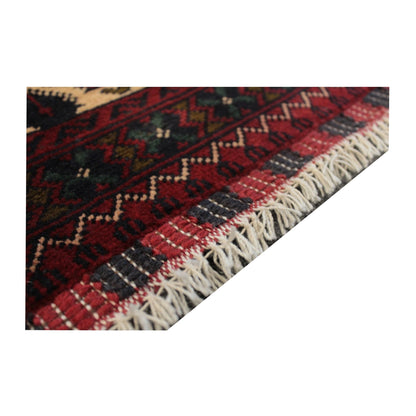 Angled end detail of Afghan Kunduz rug showing the flatwoven finishing band and visible fringe