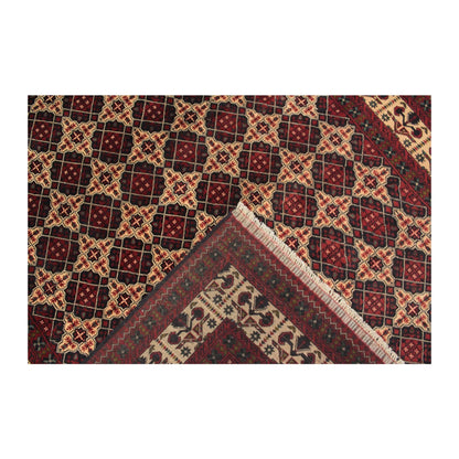 Folded-corner detail of Afghan Kunduz rug showing the patterned field, border and reverse weave