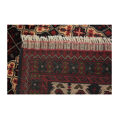 Reverse-weave end detail of Afghan Kunduz rug showing the handmade structure, flatwoven band and fringe