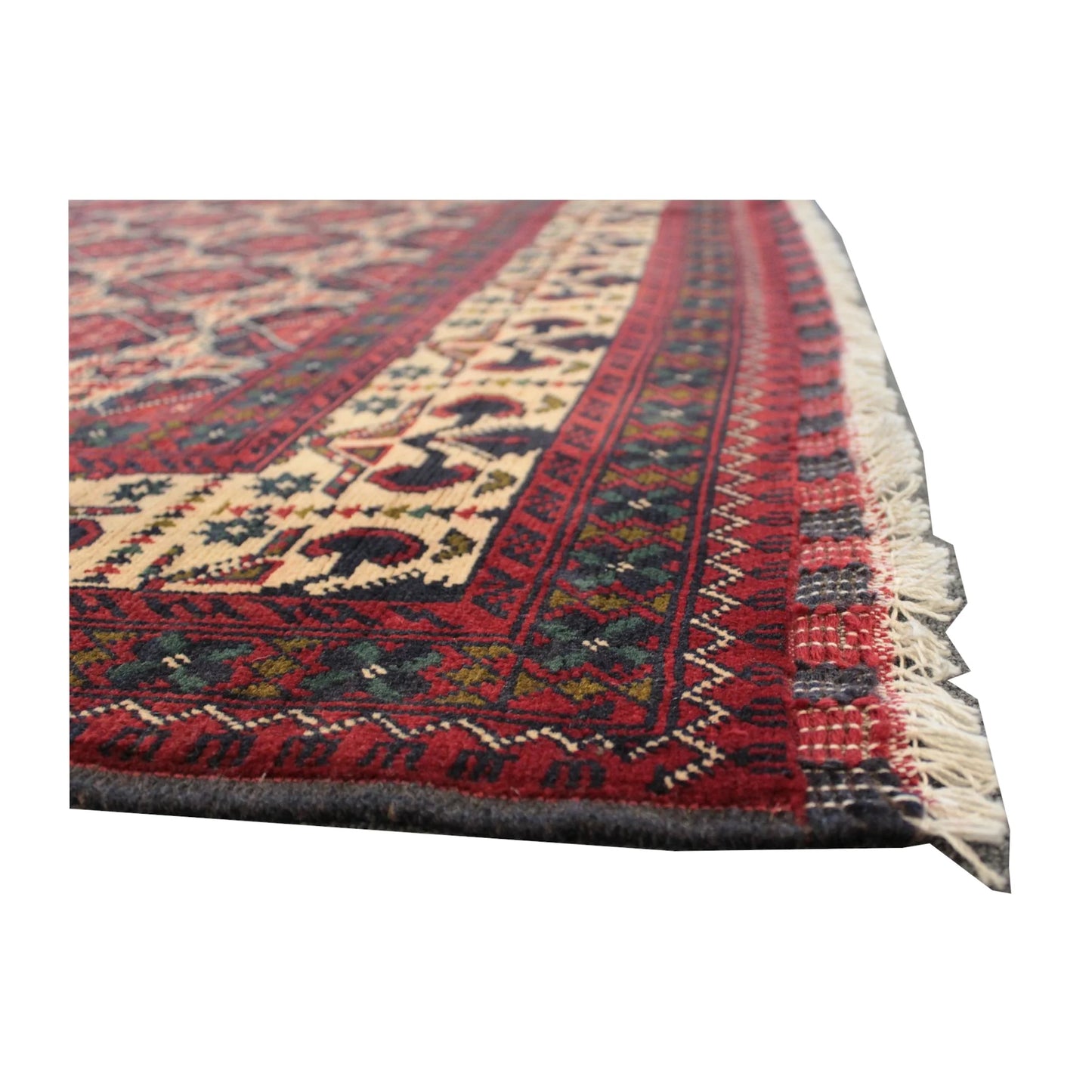 Low-angle side-border detail of Afghan Kunduz rug showing the layered border and fringe edge