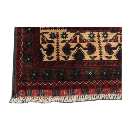 Straight-on end detail of Afghan Kunduz rug showing the patterned border and visible fringe
