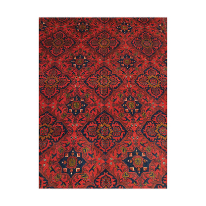 Close-up of Afghan Kunduz rug showing deep red floral lattice with navy, blue, ivory and charcoal details