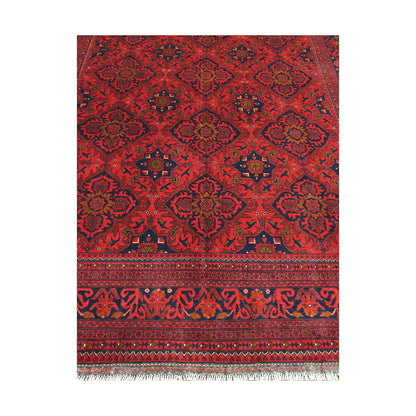 Floral lattice and border detail of Afghan Kunduz rug showing deep red field, blue accents and traditional pattern
