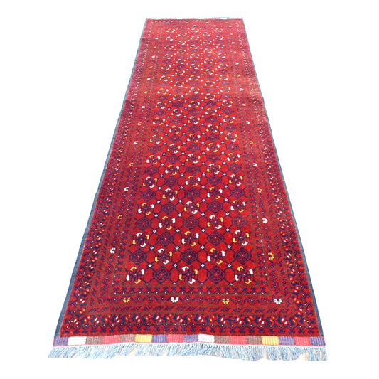Full view of Afghan Kunduz hand-knotted wool runner with deep red field, diamond lattice and layered dark borders, 285 x 85 cm