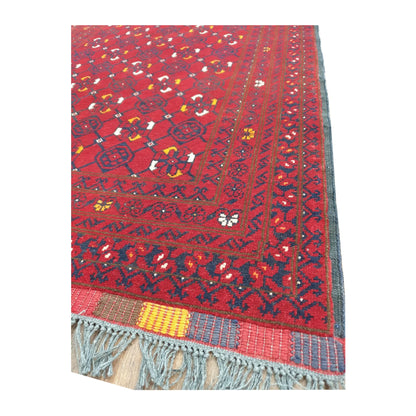 Border and fringe detail of Afghan Kunduz wool runner rug in red and navy tones, 285 x 85 cm