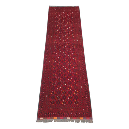 Full view of Afghan Kunduz wool runner rug with red field and repeating geometric motifs, 285 x 85 cm