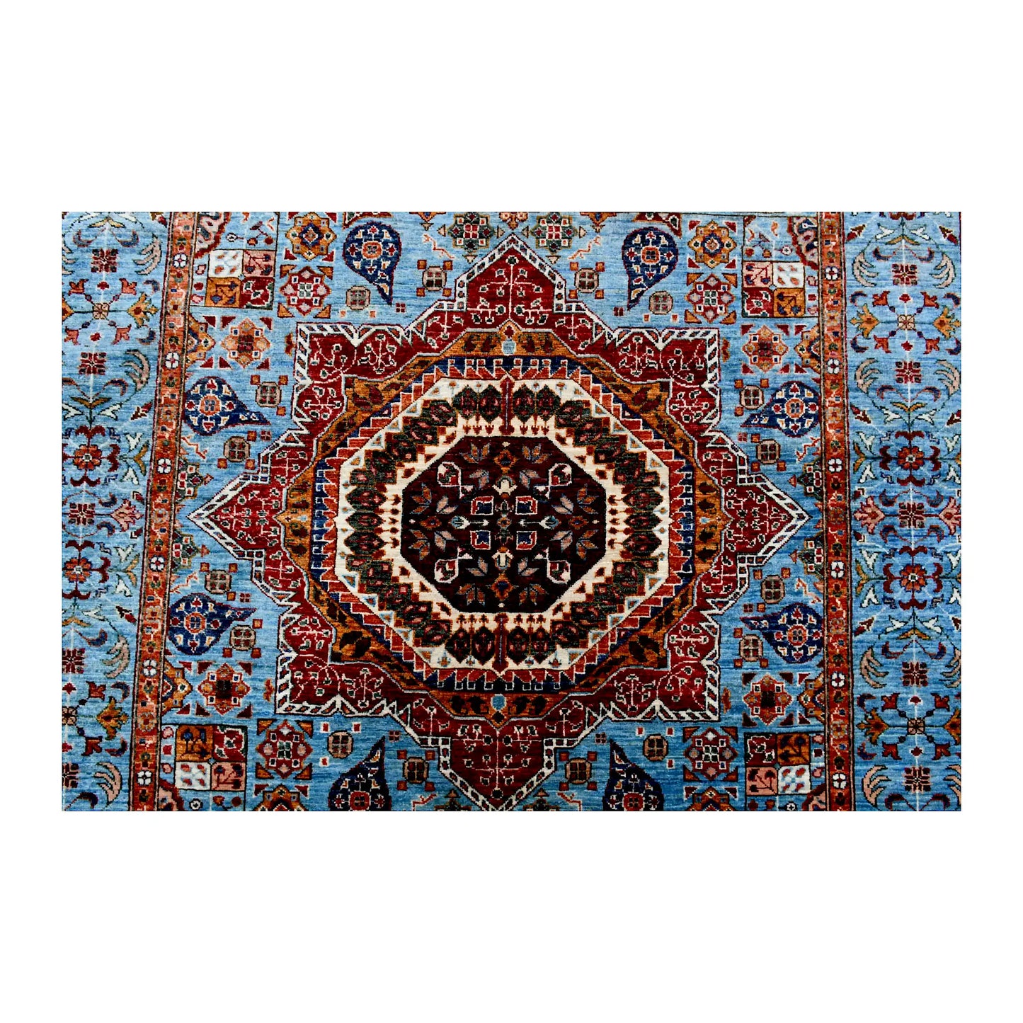 Central medallion and field detail of Afghan Mamluk wool rug showing sky-blue ground, rust red medallion and geometric-floral motifs