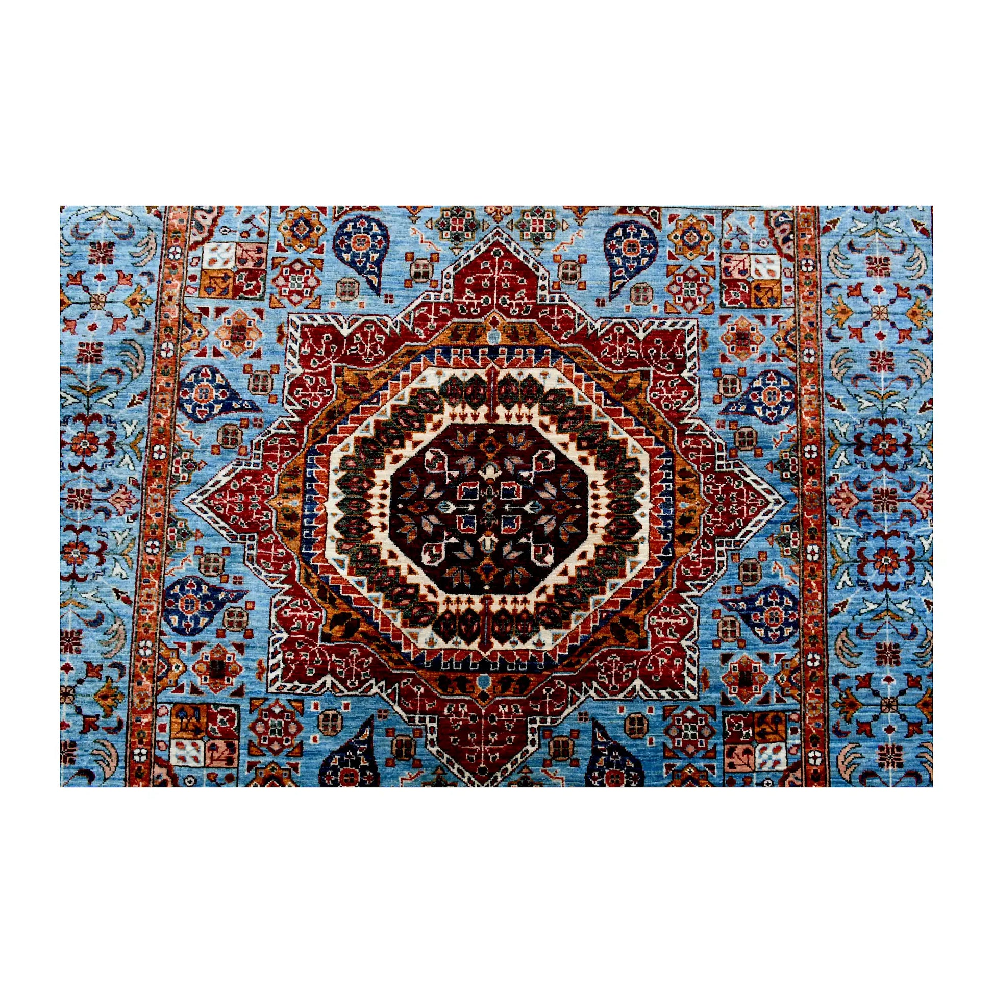 Central medallion and field detail of Afghan Mamluk wool rug showing sky-blue ground, rust red medallion and geometric-floral motifs