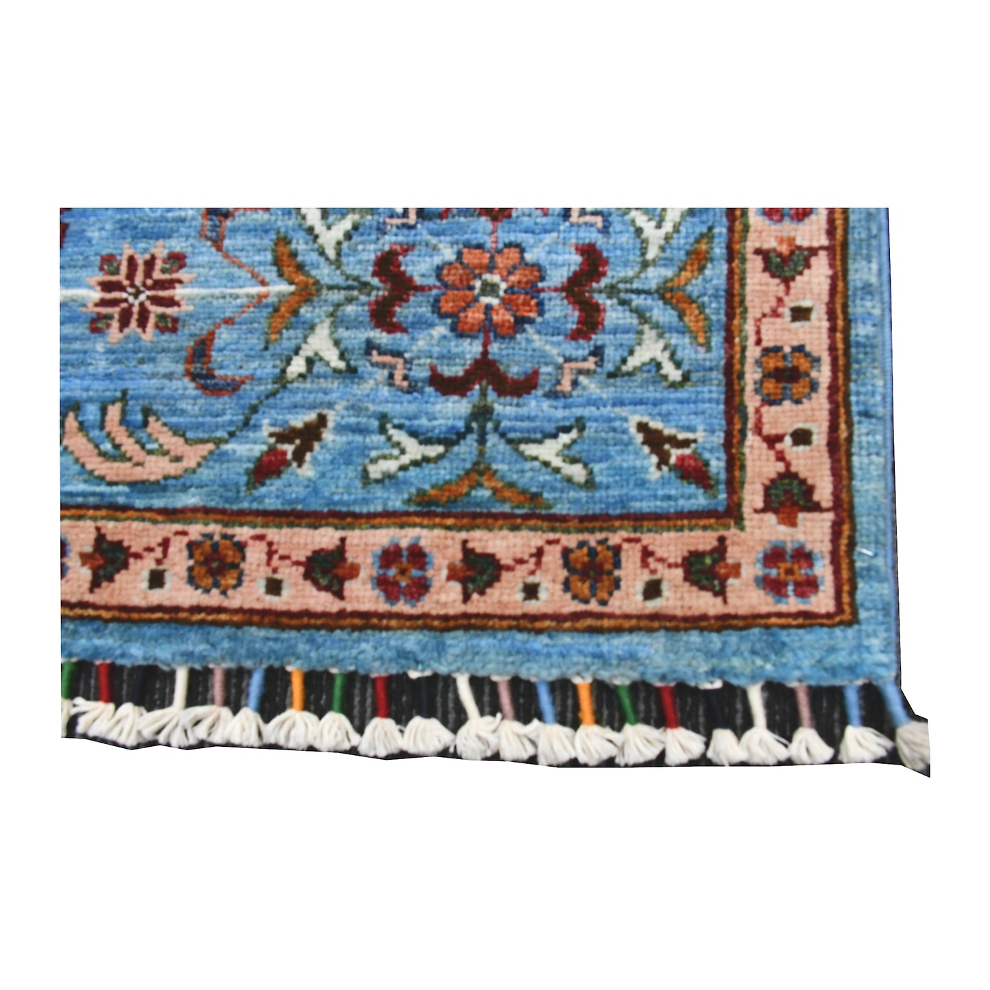 End border and fringe detail of Afghan Mamluk hand-knotted wool rug showing sky-blue field, patterned border and tassel fringe