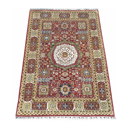 Angled view of Afghan Mamluk wool rug with geometric motifs and patterned borders, 283 x 206 cm