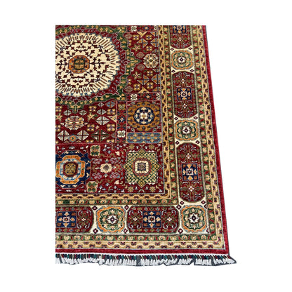 Corner-border detail of Afghan Mamluk wool rug with red field and patterned frame, 283 x 206 cm