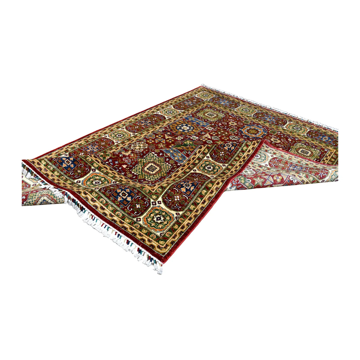 Angled view of the Afghan Mamluk rug partly folded, showing its red patterned front and pale reverse.